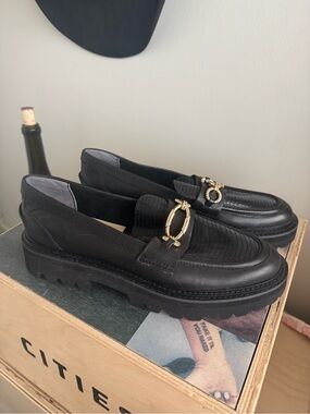 Dolce Vita Black Leather Lug Sole Loafers with Gold Buckle